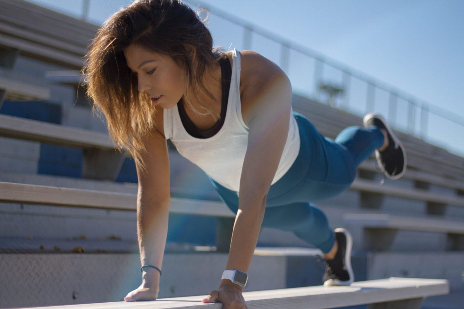 woman stretching on school benches