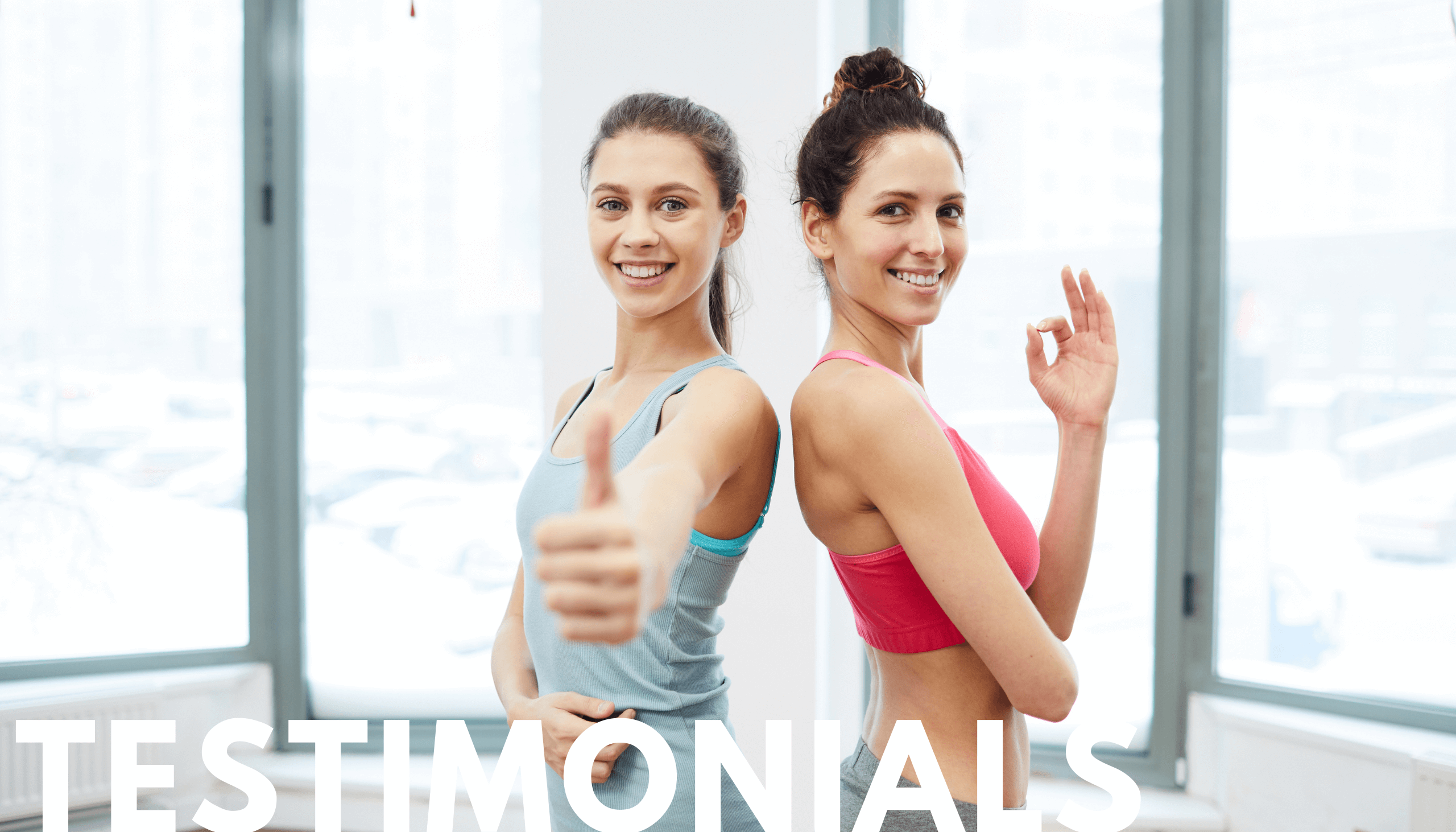 Testimonials hero two ladies posing and giving thumbs up in personal training nanaimo session