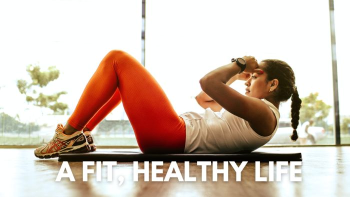 Hero image Nanaimo personal trainer stretching on floor with black mat at gym overlay states a fit, healthy life without the gym