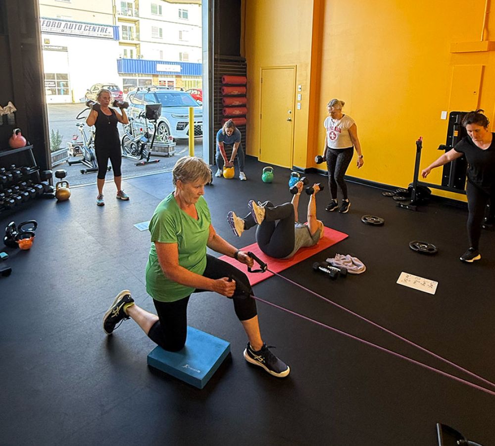 Clients working on small group training at Oceanside Strength Academy