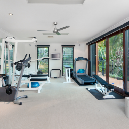 Nanaimo personal trainer home gym setup white walls and carpet